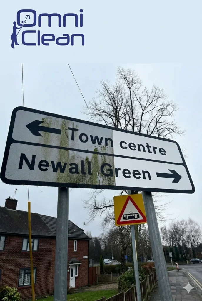 Newall Green road sign half cleaned by Omni Clean, showing algae removed