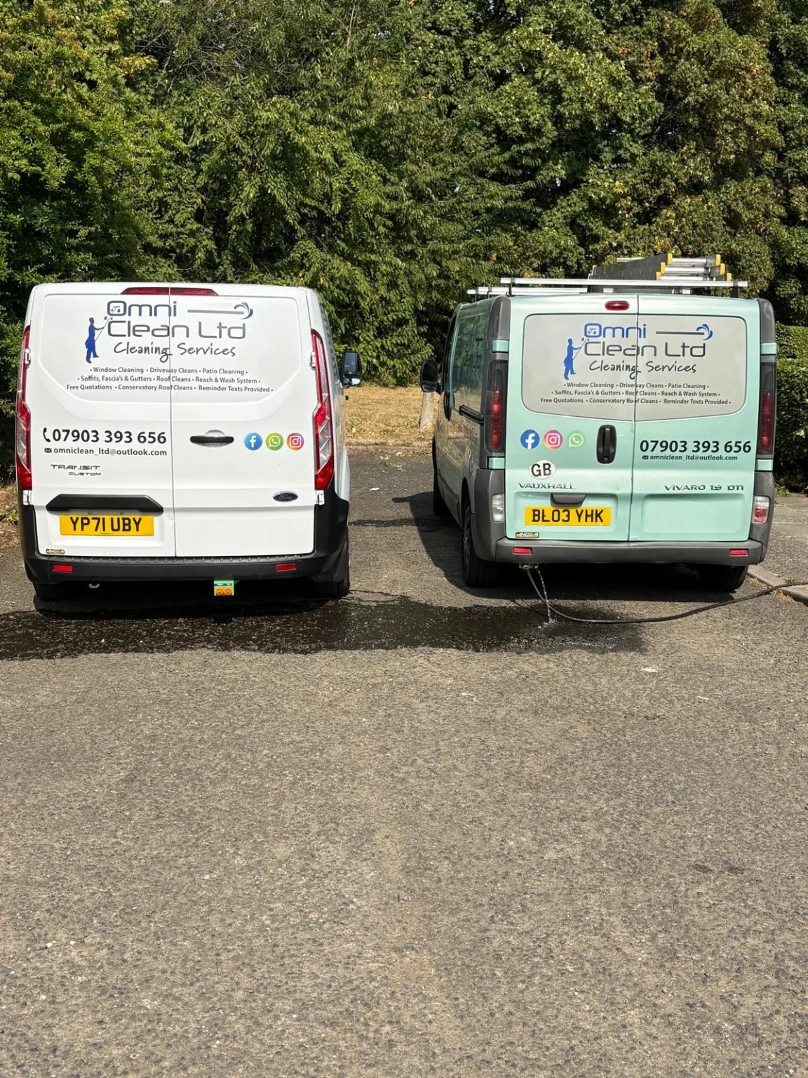 Two Omni Clean Ltd vans parked side by side in Manchester