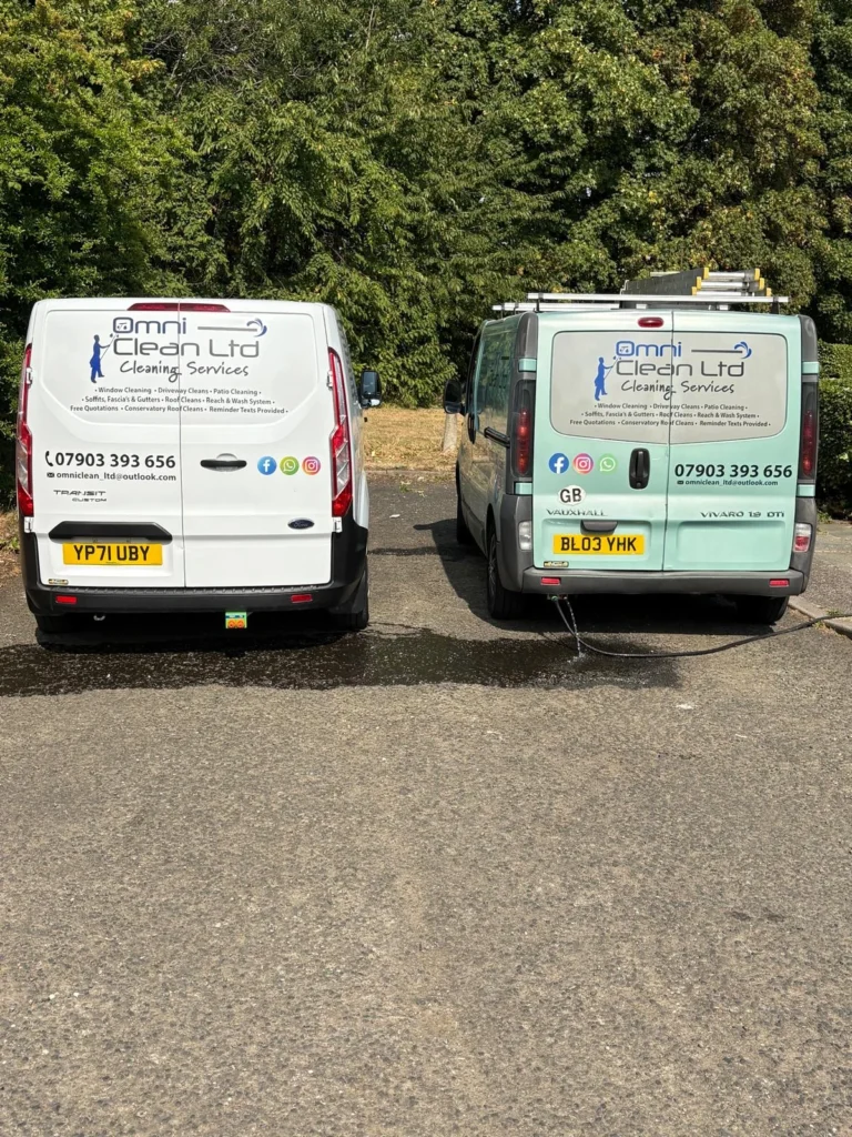 Two Omni Clean Ltd vans parked side by side in Manchester